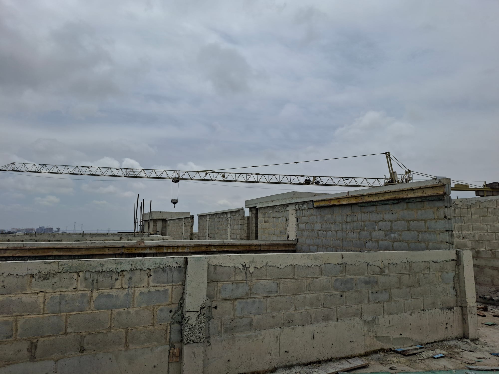 Tower crane operating over an active Soapworth construction site